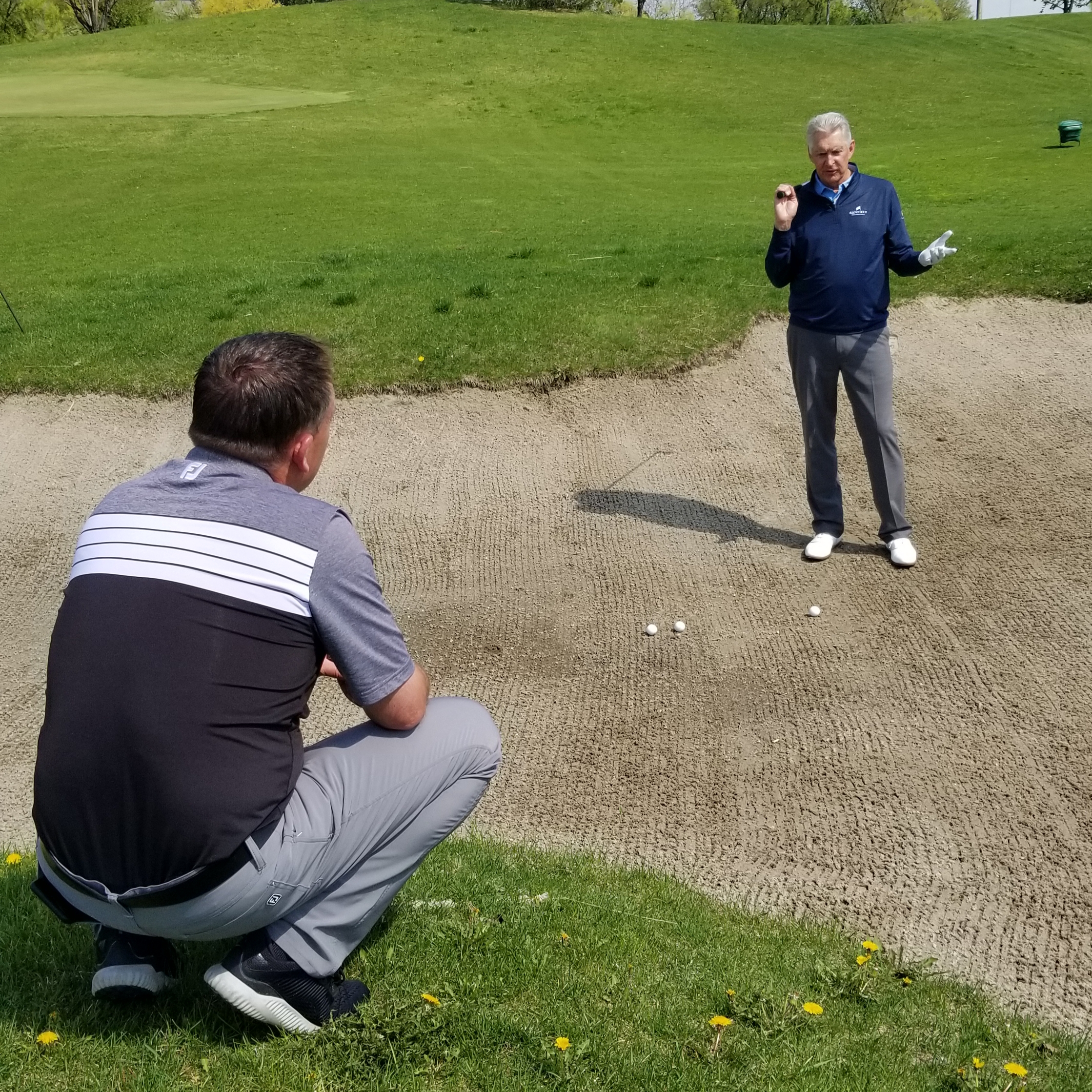 Todd Kolb and Andy North discussing bunker shots