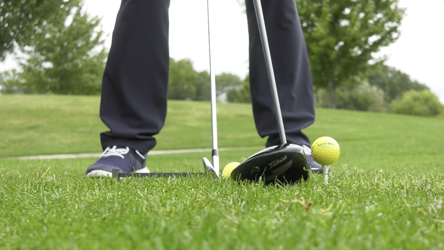 Man preparing to hit a golf ball