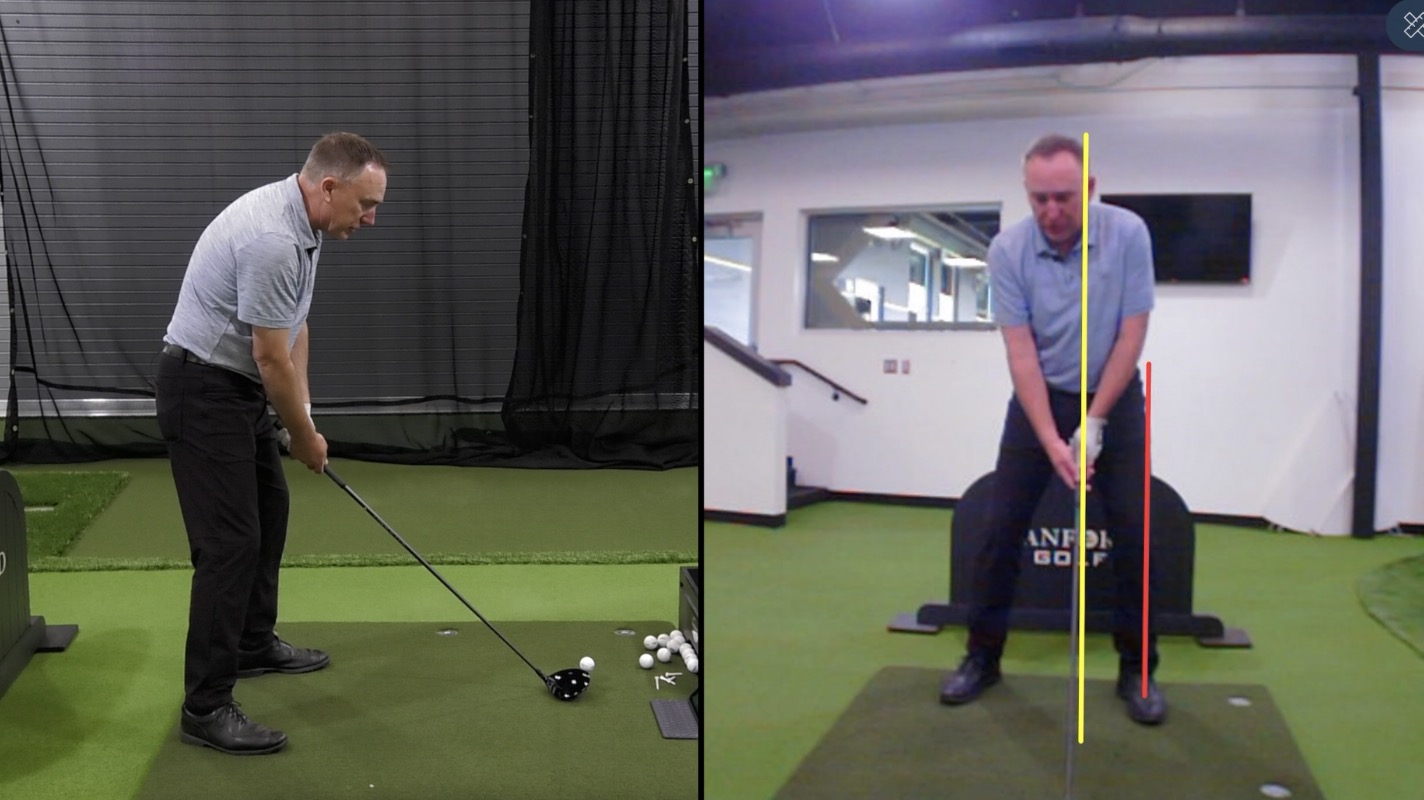 Man practicing his swings on an indoor golf course